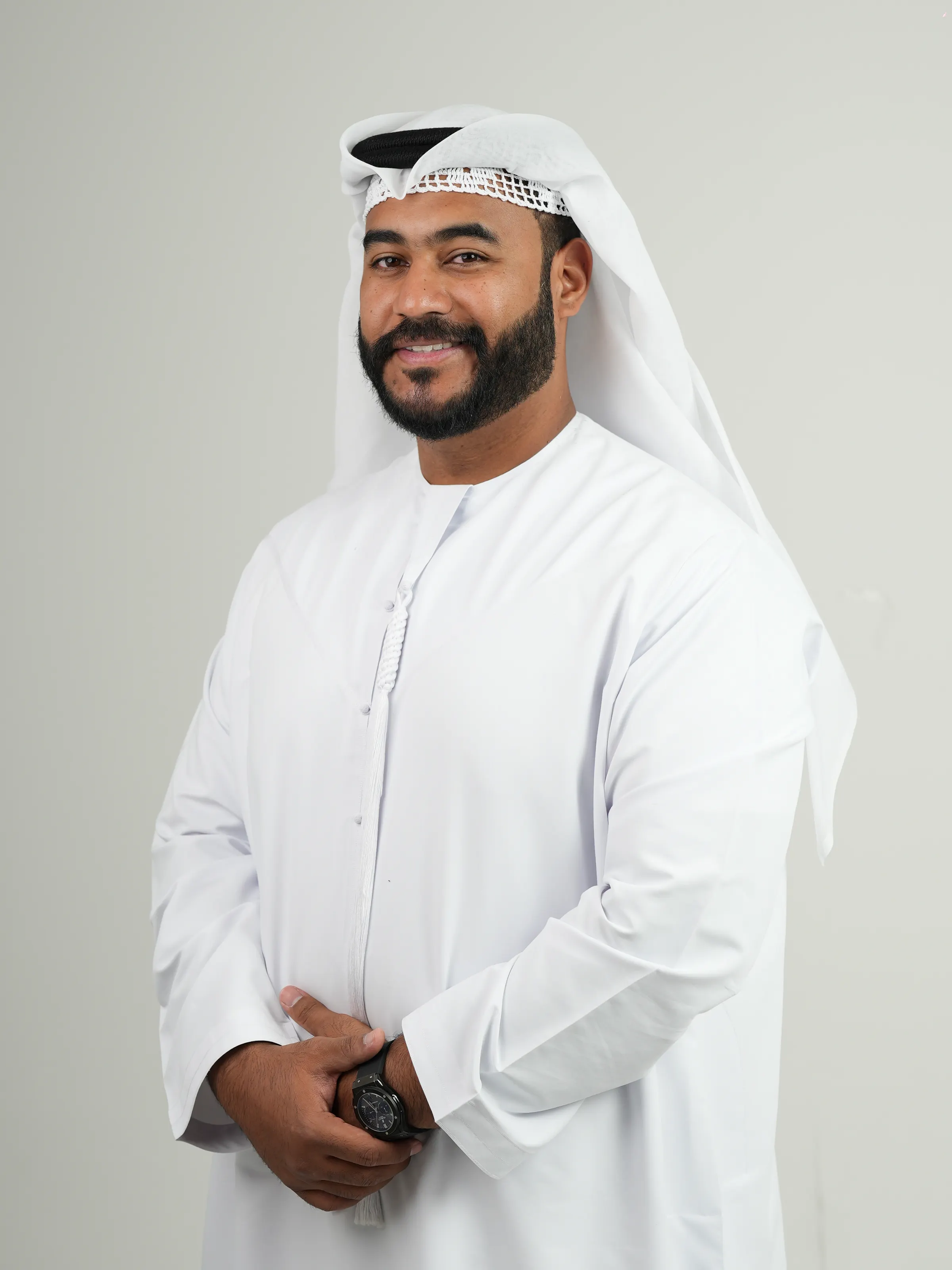 Fahed Teaib Albaloushi, founder of Evo Media Pro, in a white kandura against a pale studio background